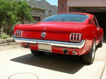 Picture of the rear of the car with the billet tail light covers.